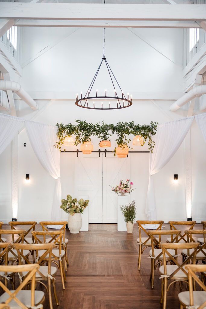A Nashville wedding venue featuring greenery and a chandelier.