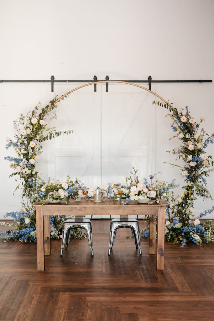 Blue floral sweetheart table at a wedding at 14TENN 