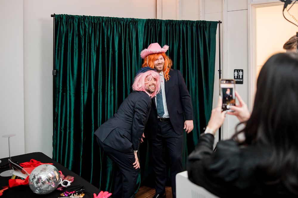A photo backdrop with funny props at a Nashville wedding
