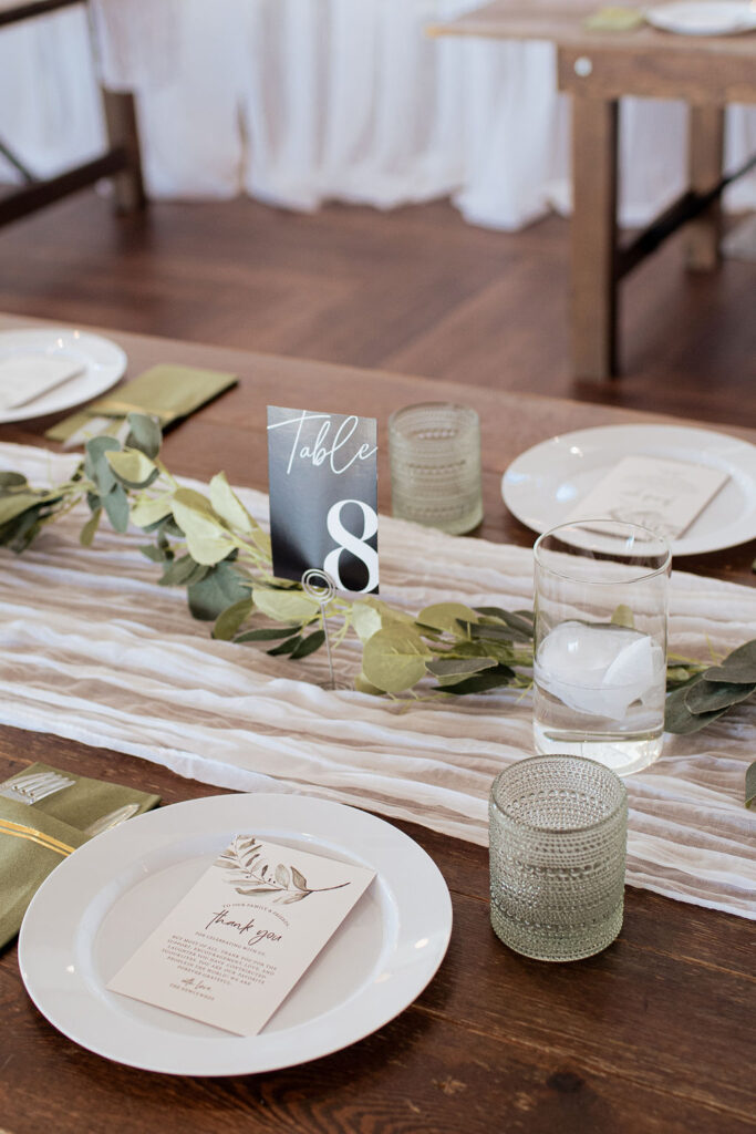 Table decor with simple greenery and vintage glassware