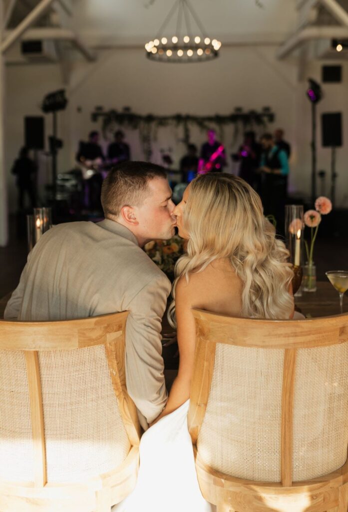 Bride and groom reception kiss