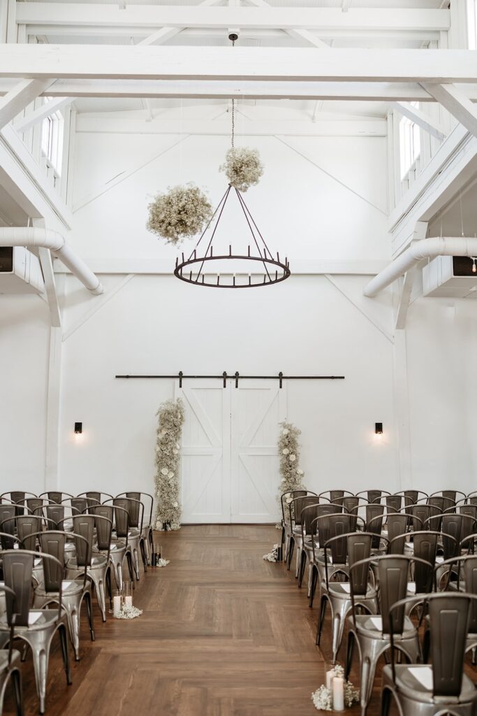 Wedding ceremony setup in front of barn doors at 14TENN