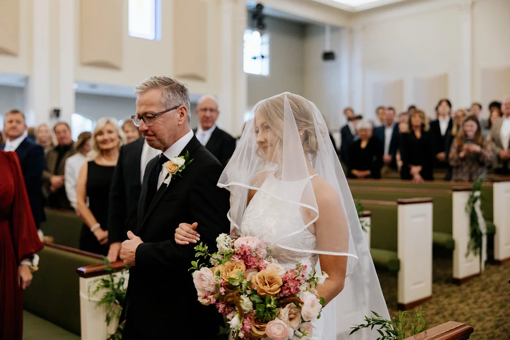 Bride and dad walking down aisle