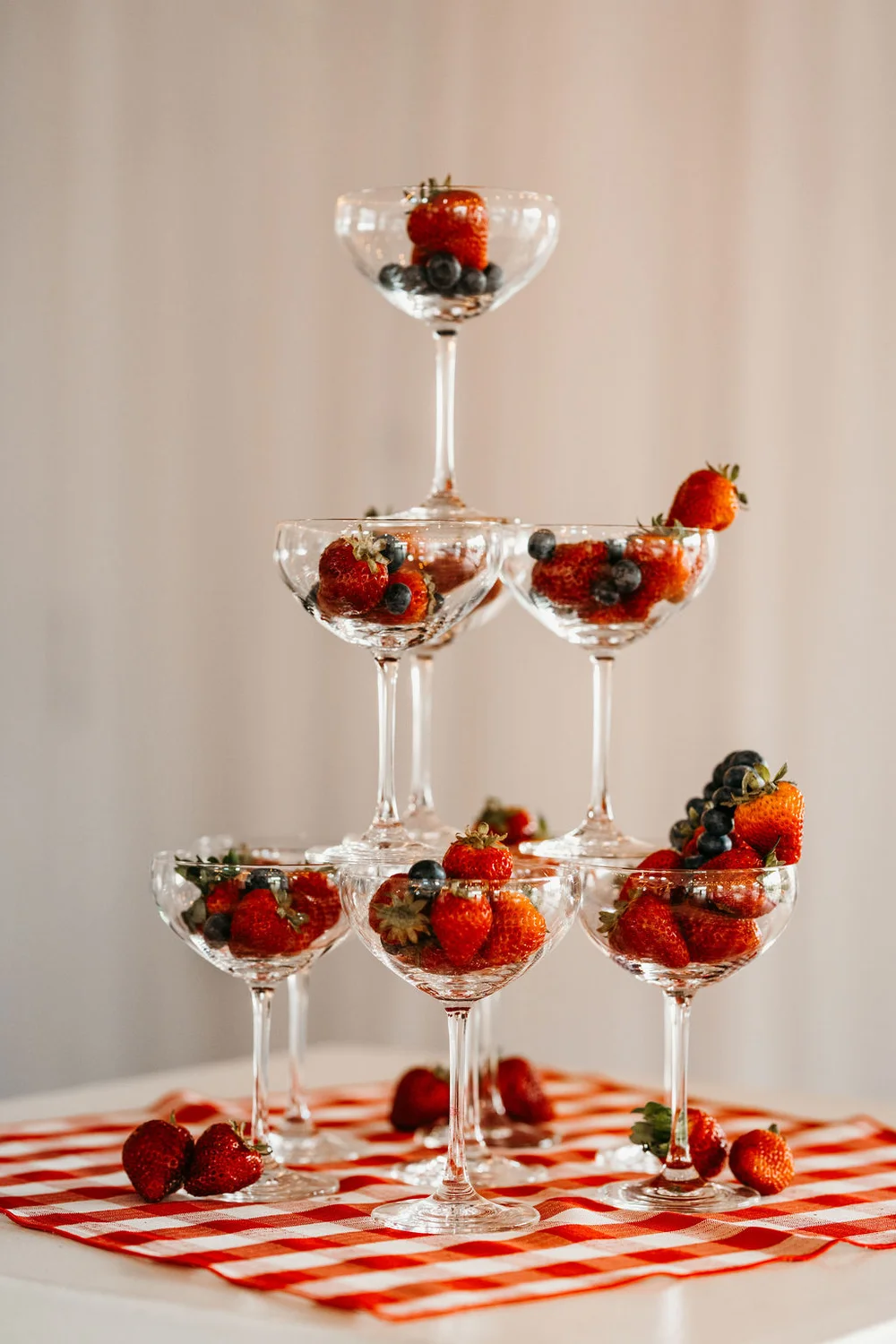 Champagne tower with glasses filled with fresh berries at 14TENN Open House