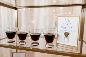 Espresso martinis sitting on a gold shelf