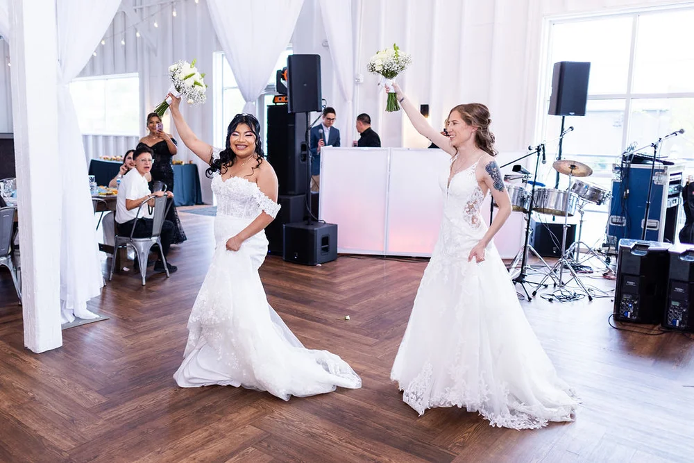 Two brides dancing into their wedding reception at 14TENN Nashville