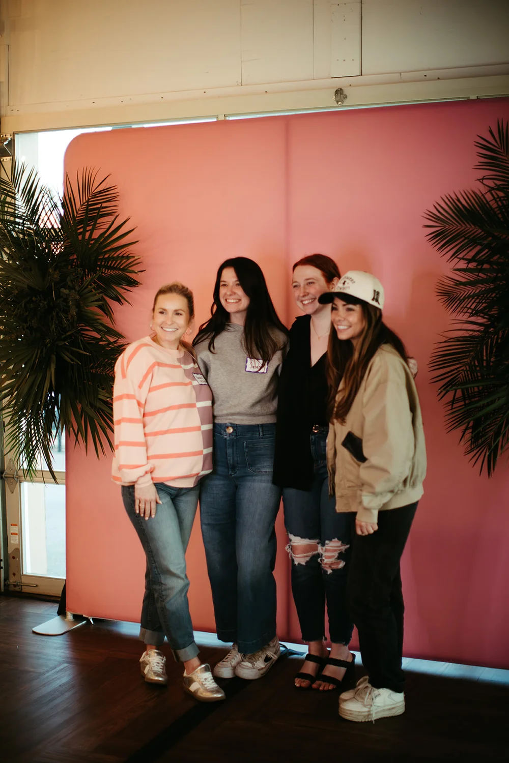 Four women posing at a photo booth during a wedding industry networking event at 14TENN Nashville