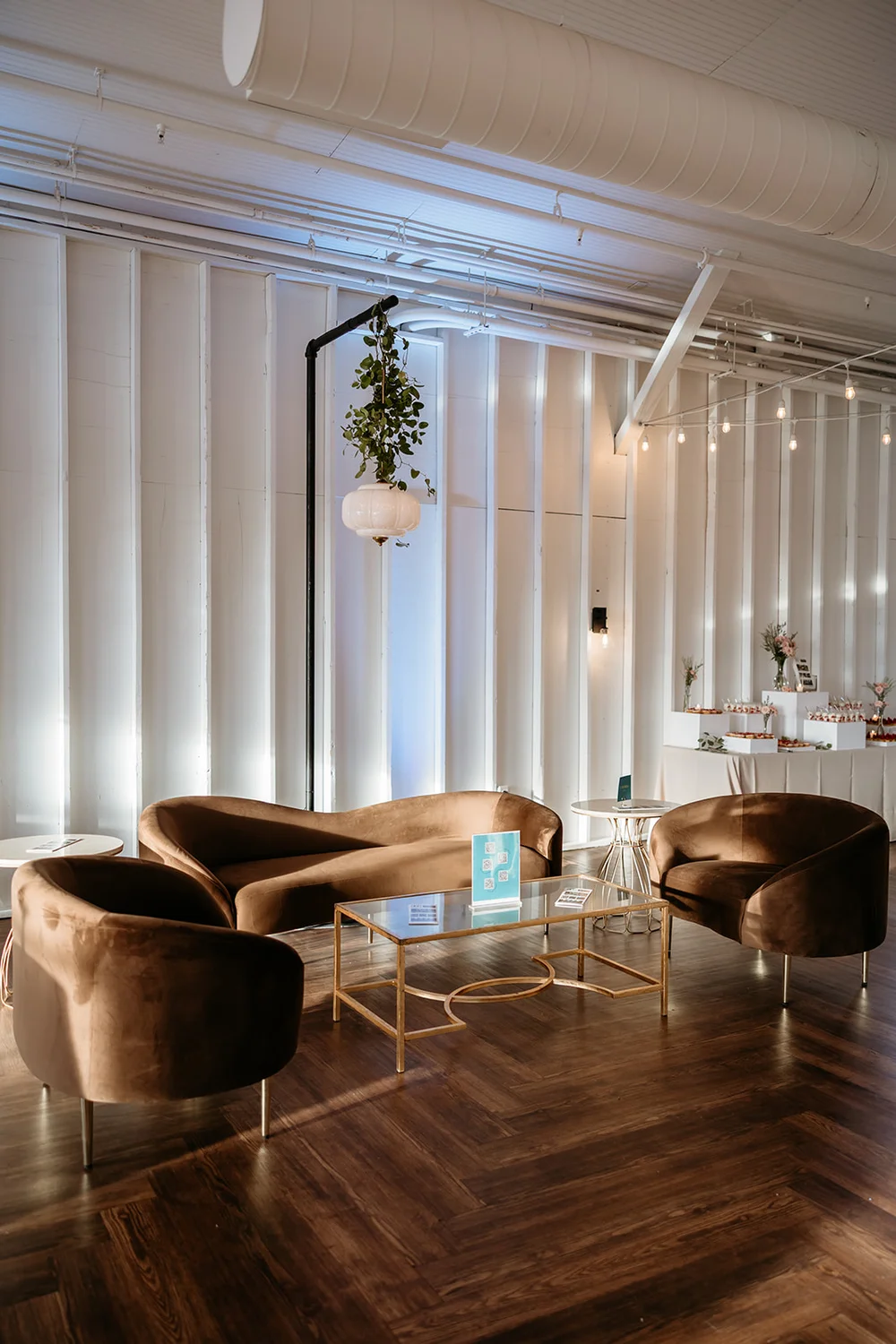 Lounge area with sleek brown velvet chairs at 14TENN event venue in Nashville TN
