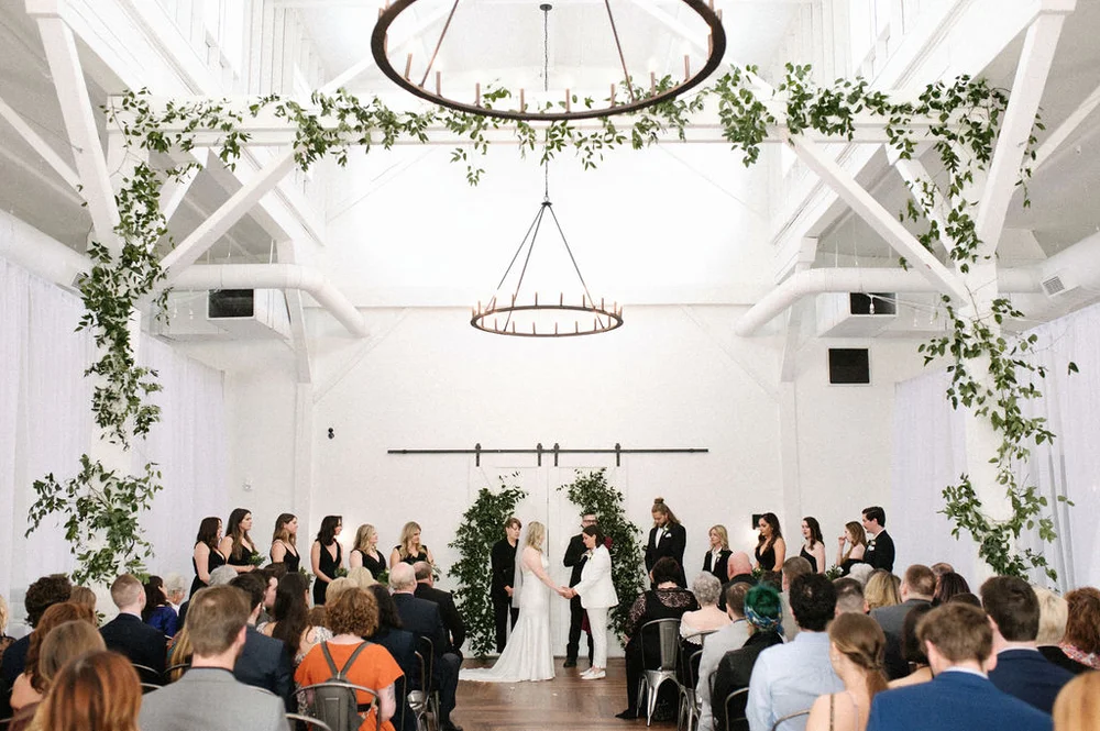 LGBTQ+ brides saying their vows at 14TENN wedding venue in Nashville TN